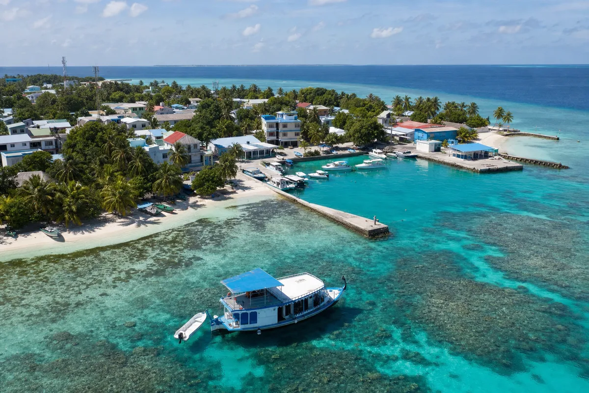 Maldivian local island, harbour and dive dhoni from above